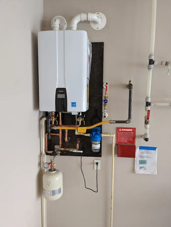 Professional plumber installing copper piping in a Aransas Pass home